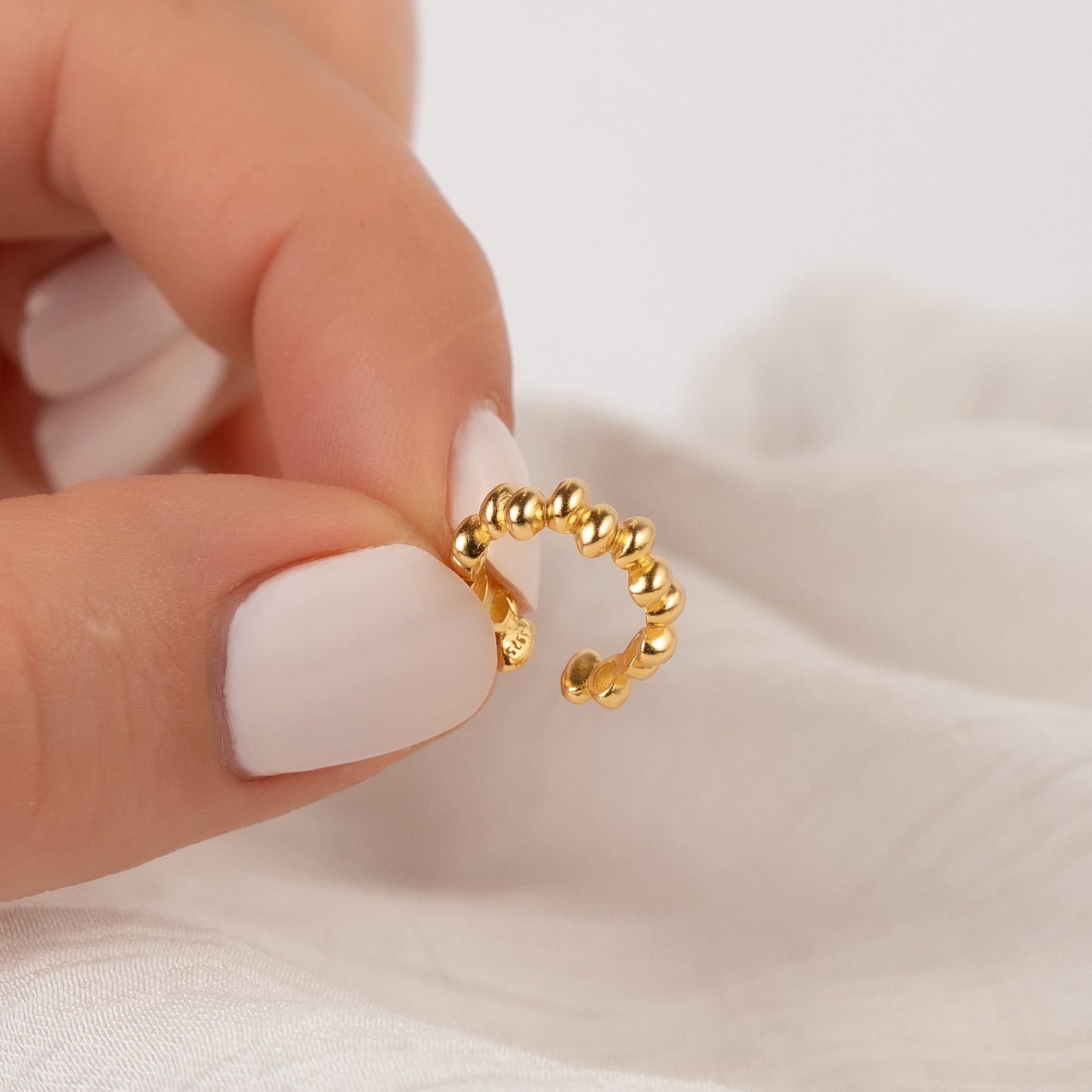 Aro ear cuff palitos bañado en oro