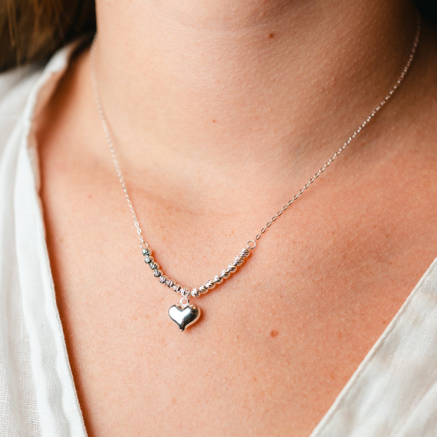 Collar corazón y esferas