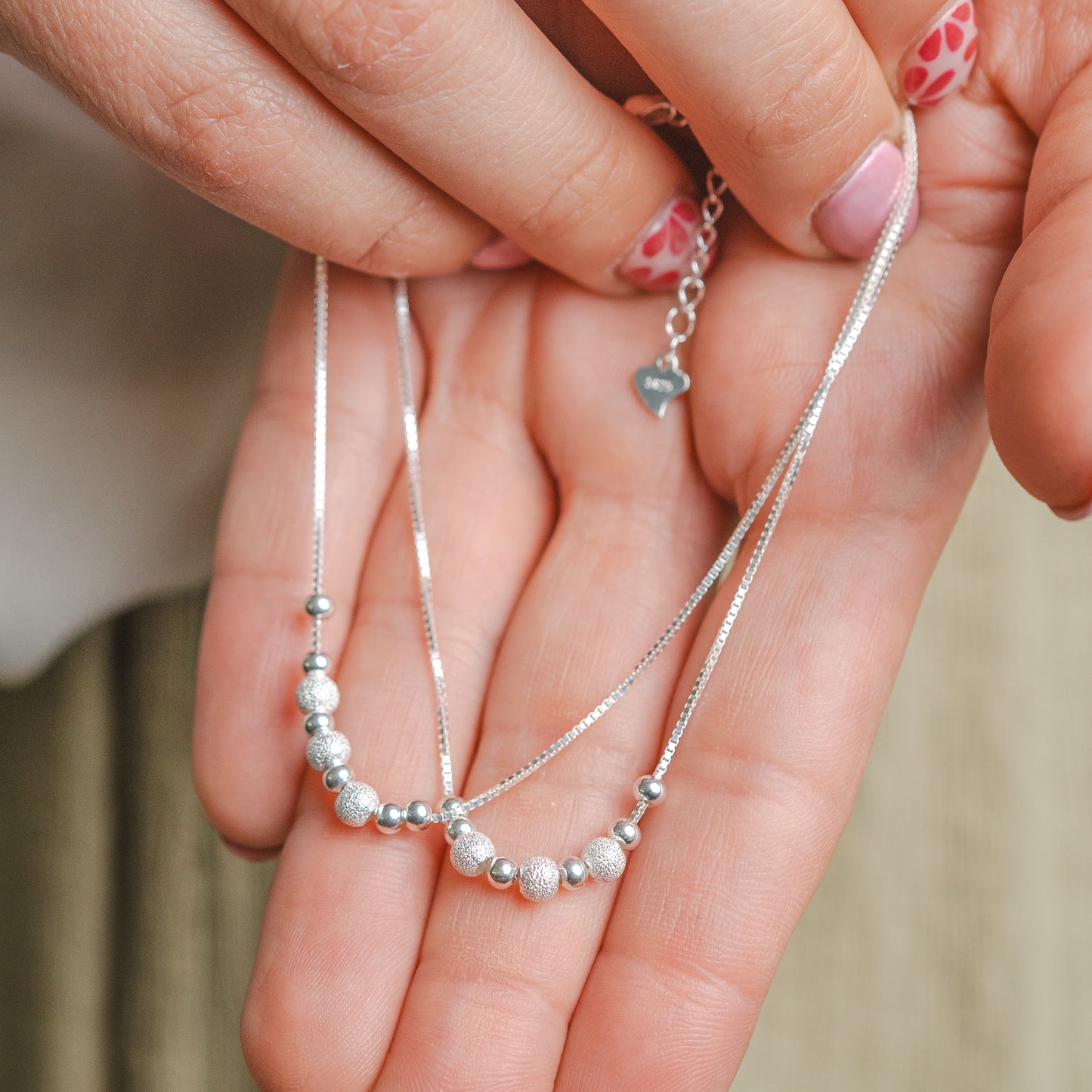 Pulsera doble esferas brillantes