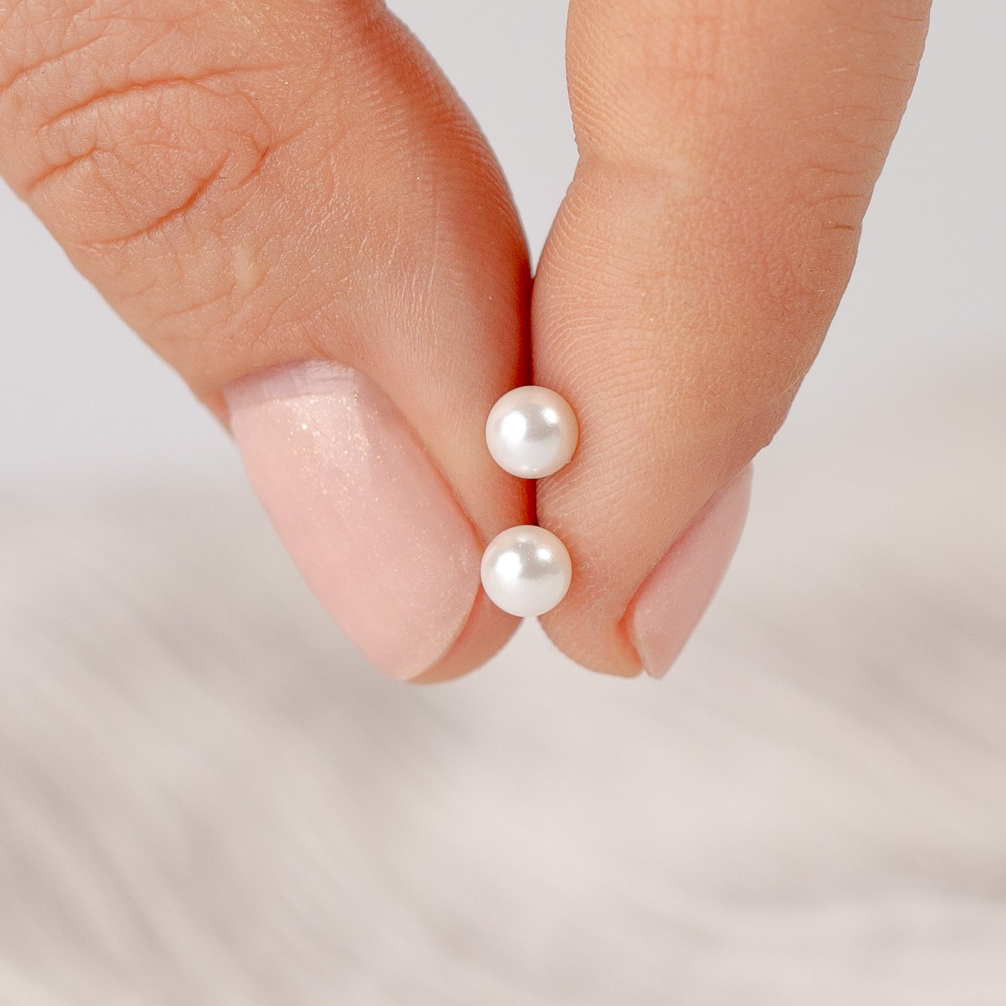Aros pegados perla con tope