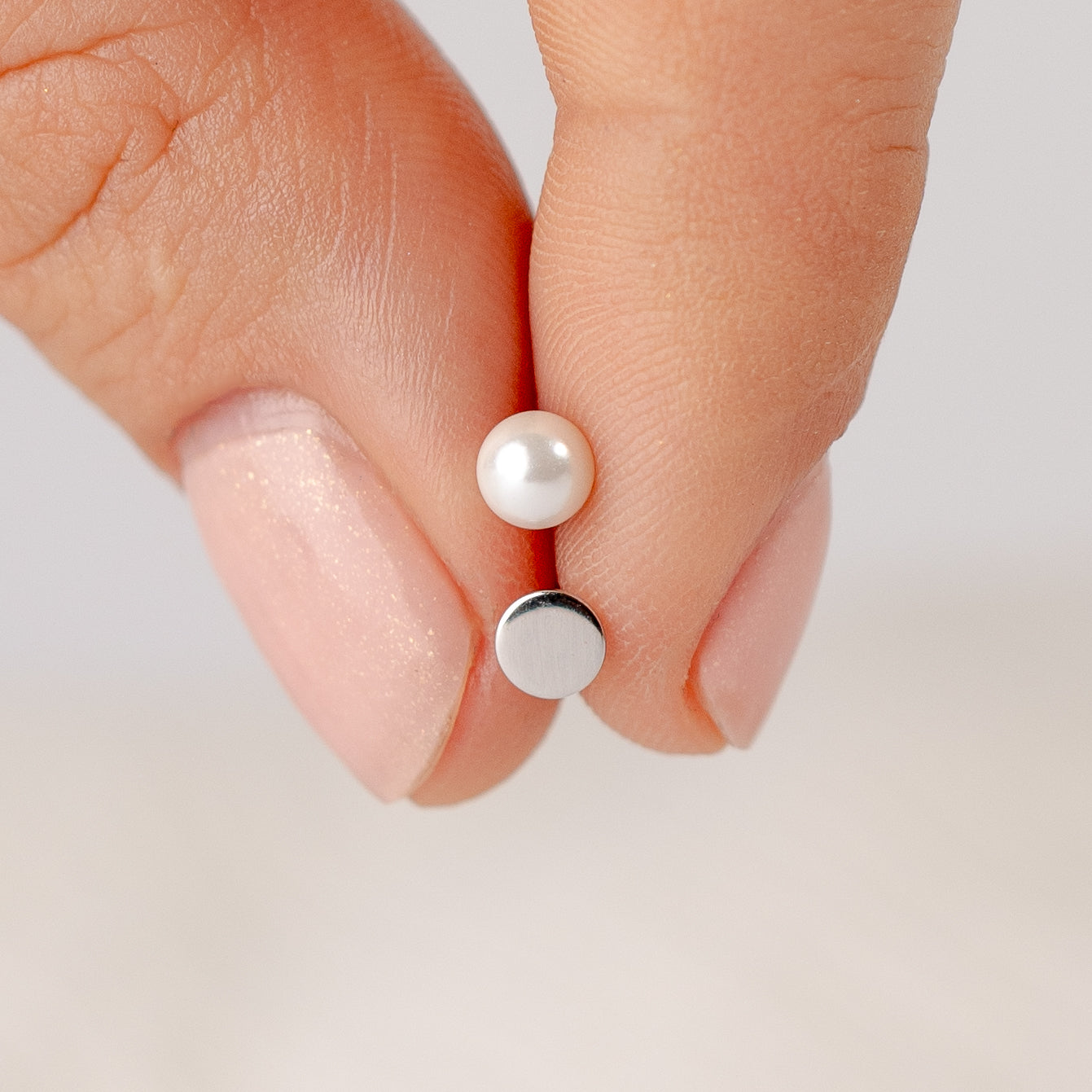 Aros pegados perla con tope