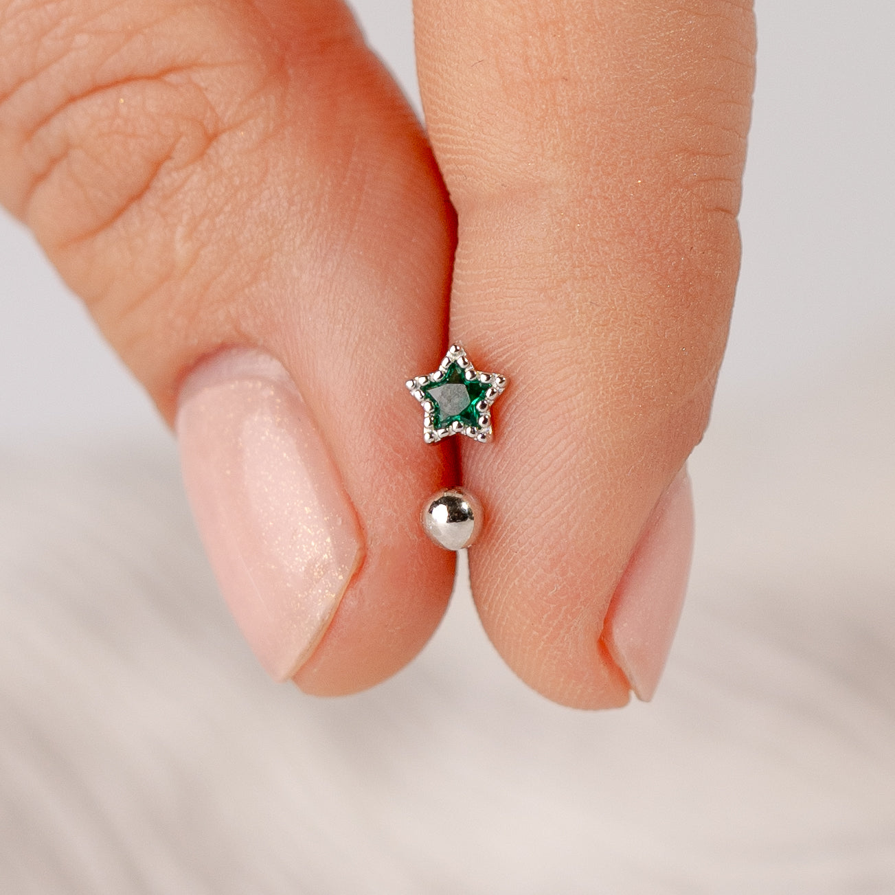 Aros pegados estrella verde cierre pelotita