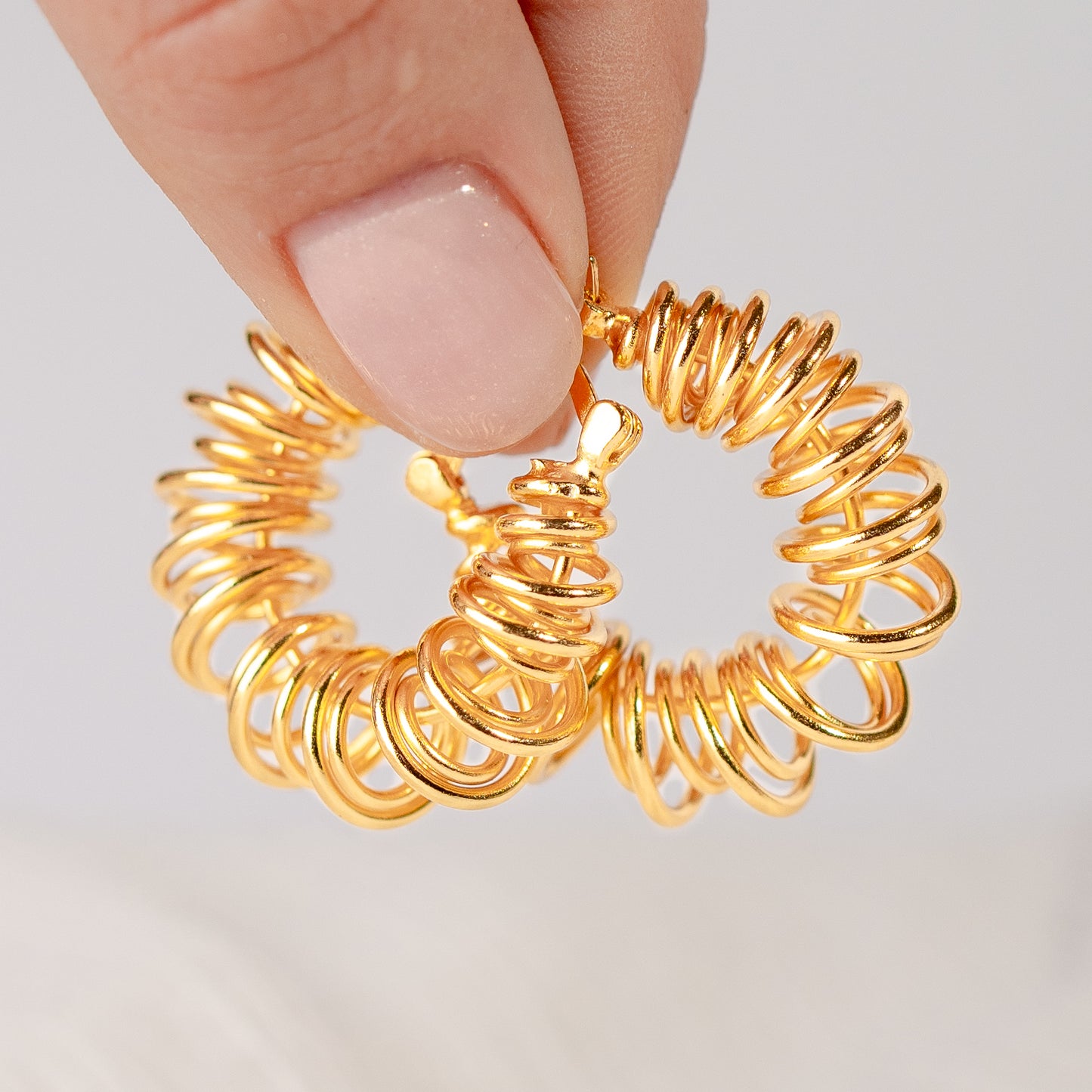 Aros argolla espiral bañado en oro
