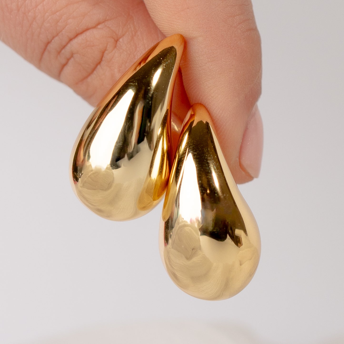 Aros pegados gota inflada bañada en oro