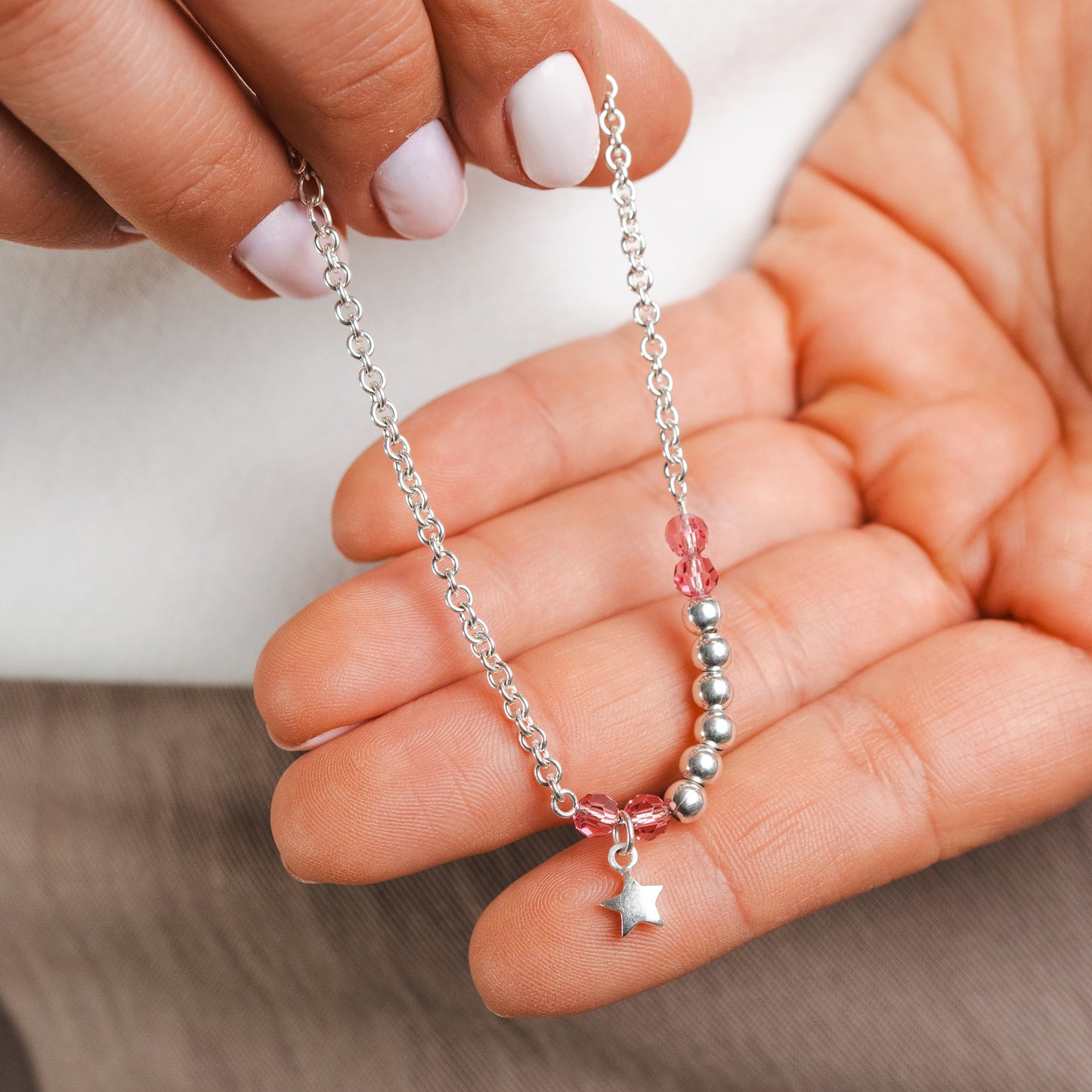 Pulsera mostacillas rosa y estrella