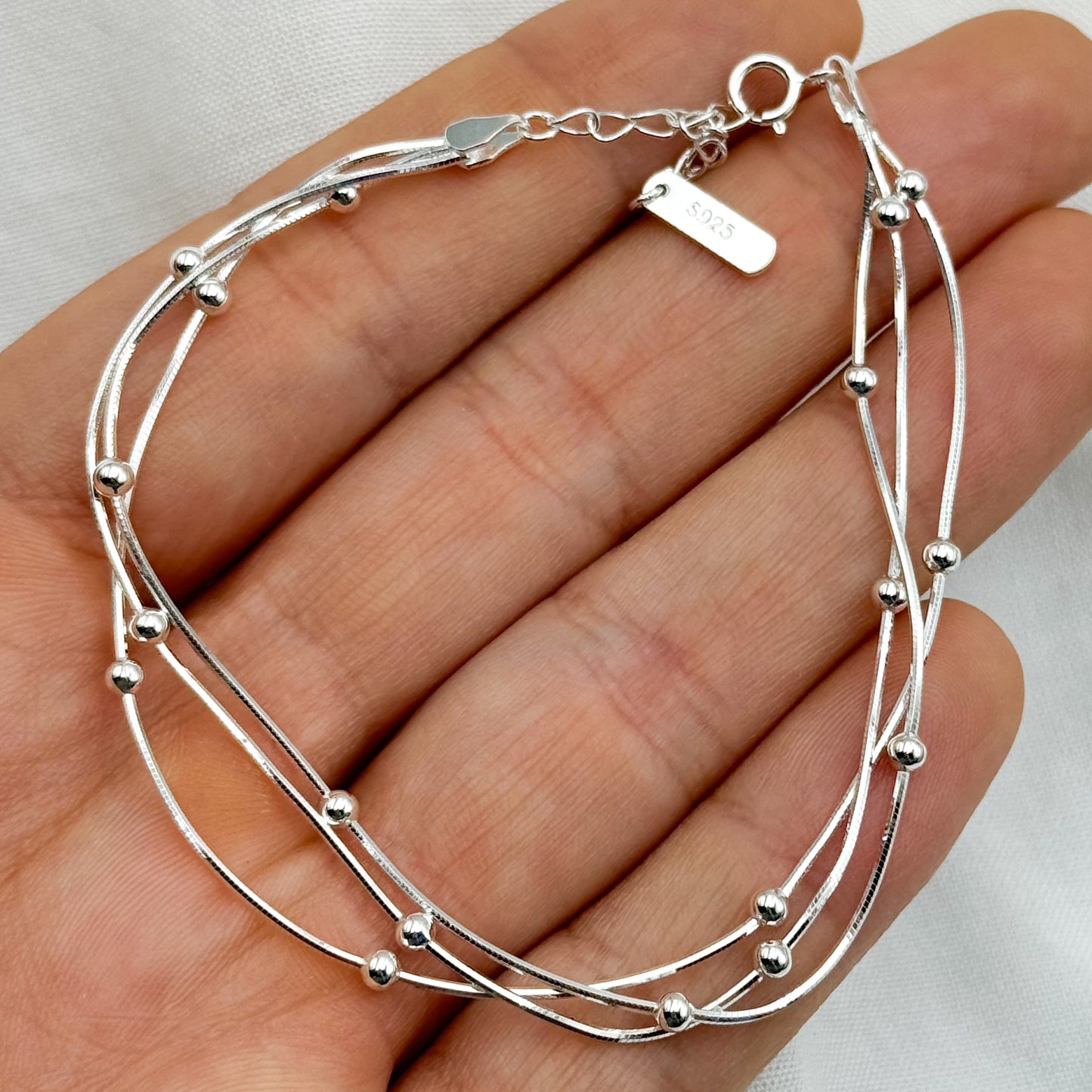 Pulsera triple esferas