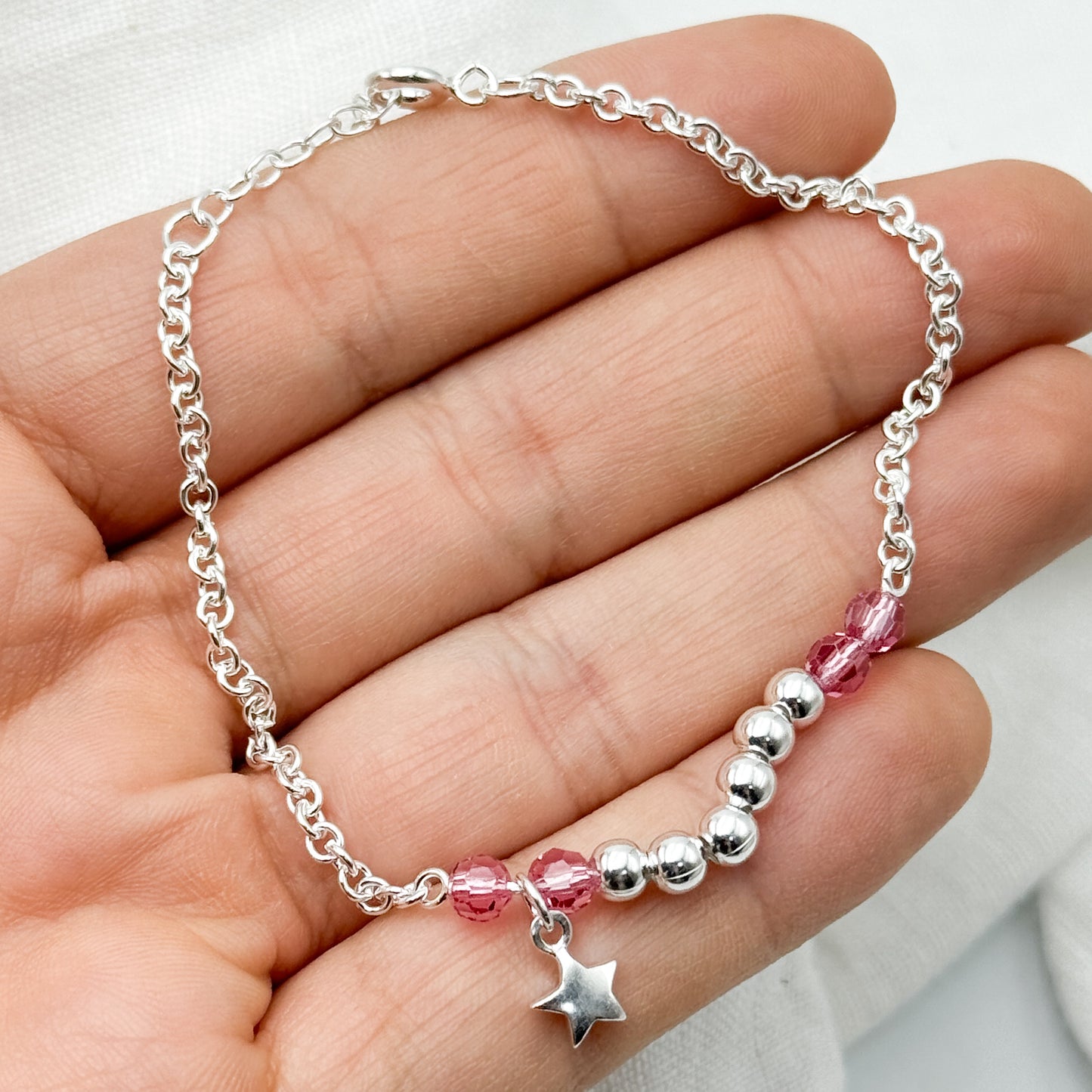 Pulsera mostacillas rosa y estrella