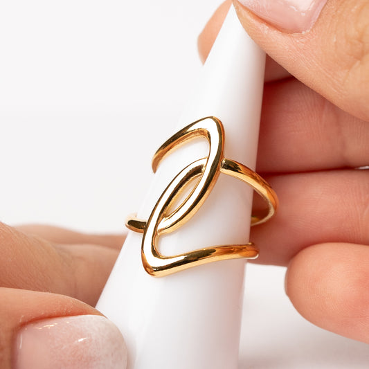 Anillo ajustable diseño cruzado bañado en oro