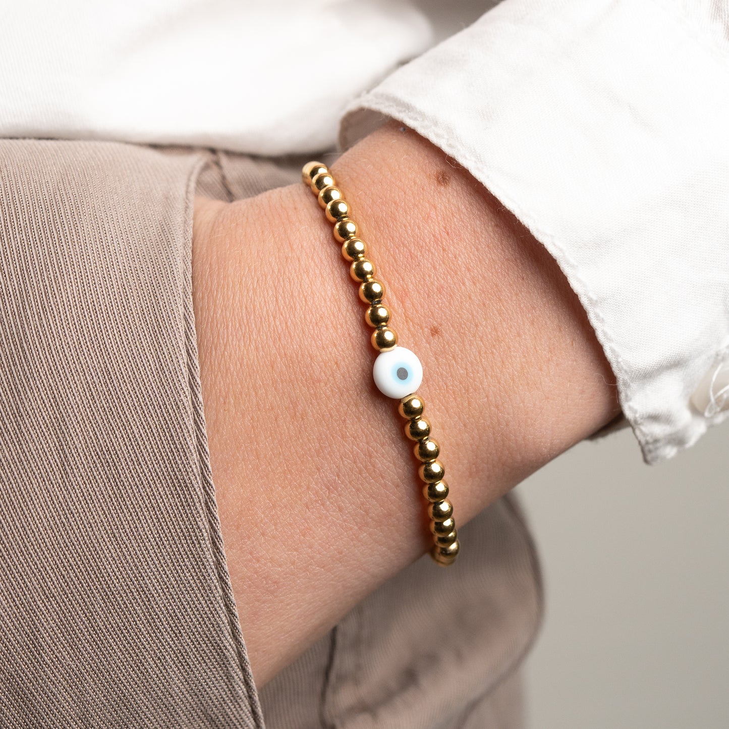 Pulsera ojo turco y esferas bañado en oro