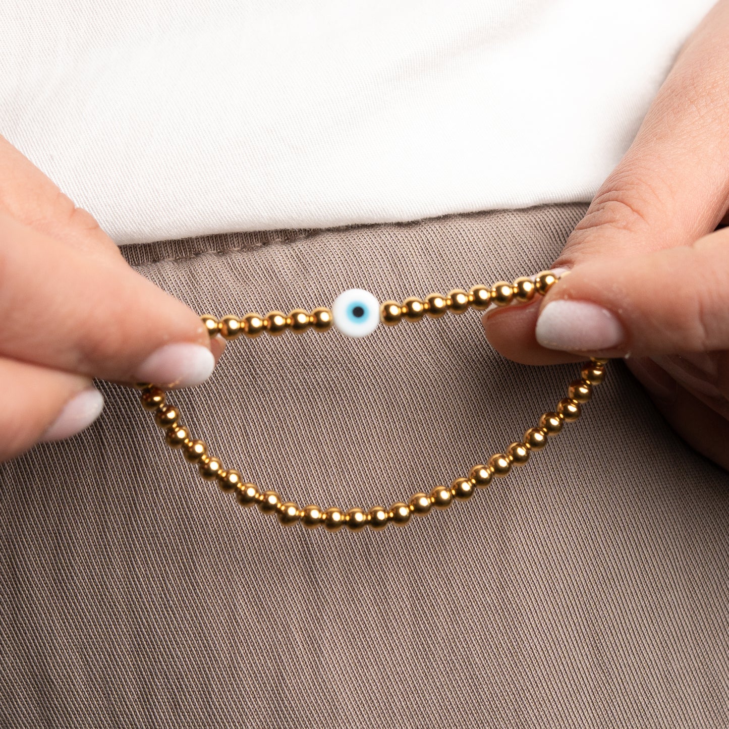 Pulsera ojo turco y esferas bañado en oro