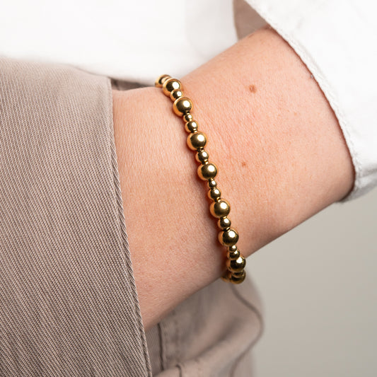 Pulsera esferas bañado en oro