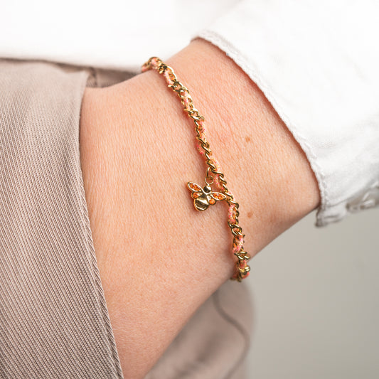 Pulsera de abeja con hilo rosado bañado en oro