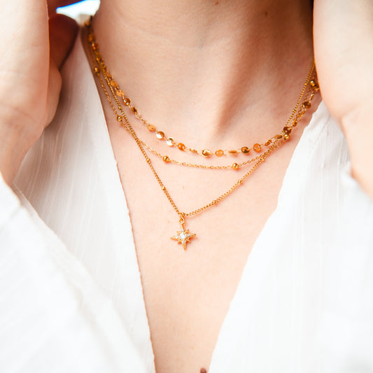 Collar triple estrella fugaz bañado en oro