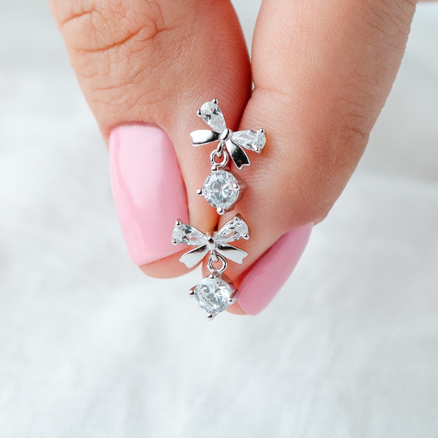 Aros pegados lazo circón