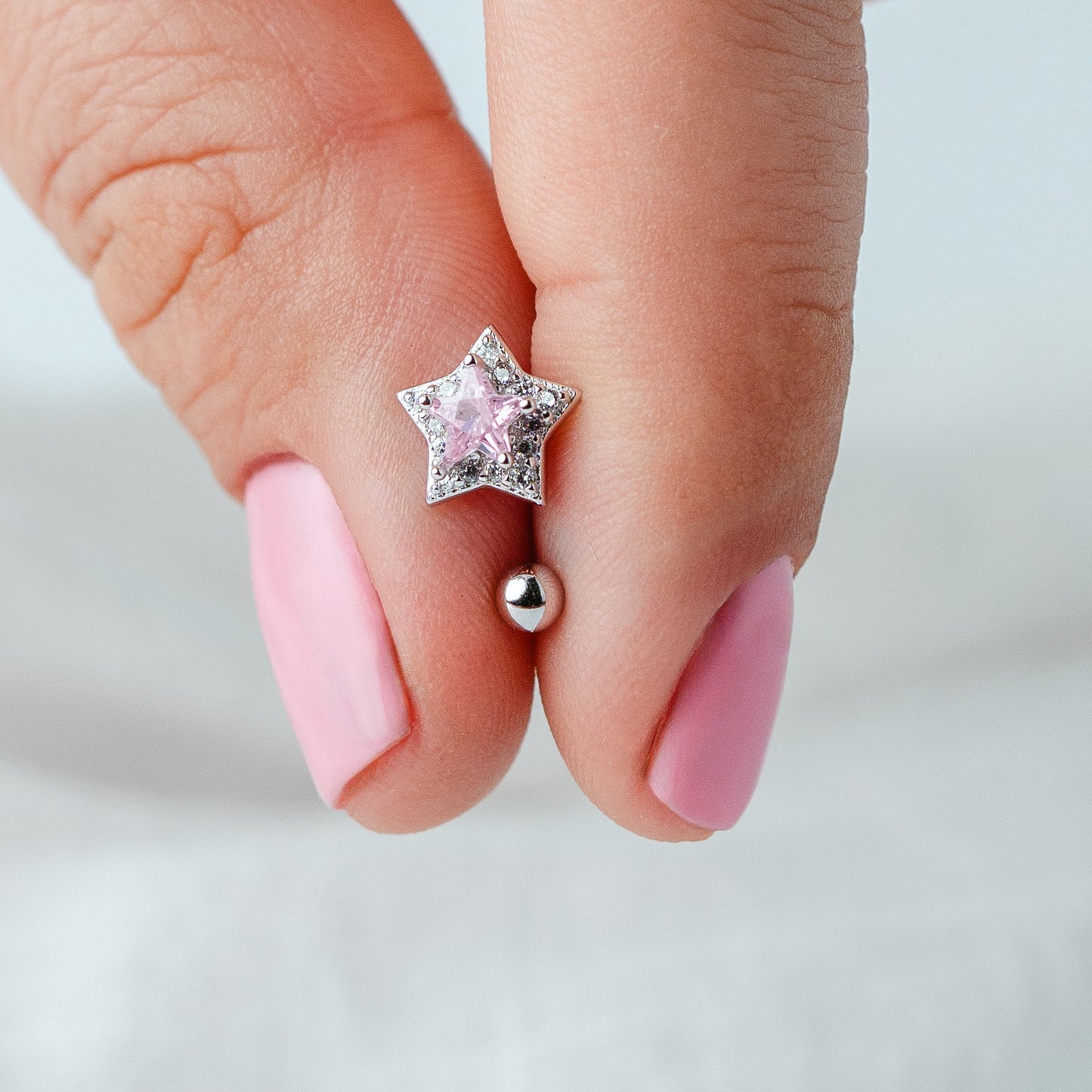 Aros pegados estrella rosa cierre pelotita