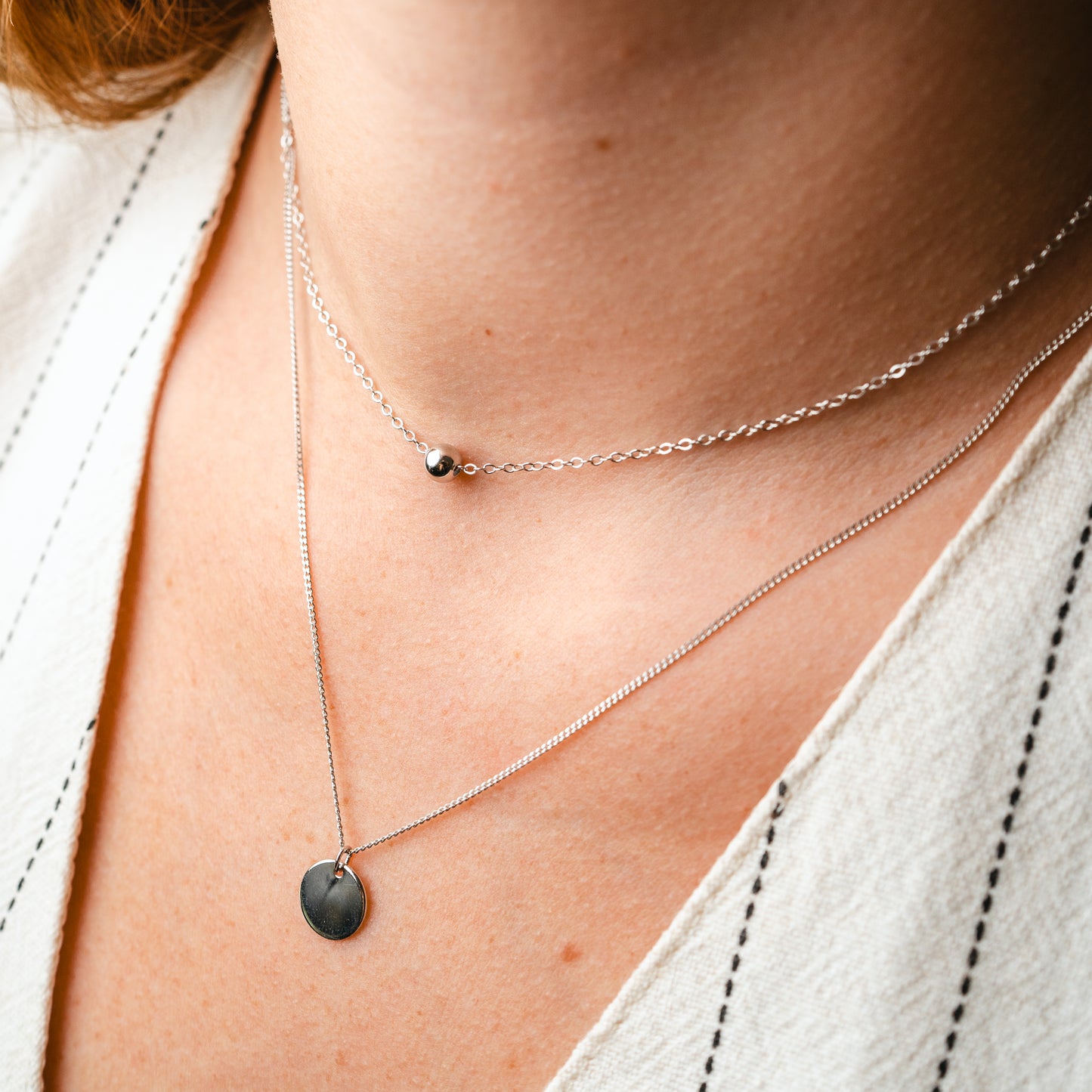 Collar doble esfera y medalla