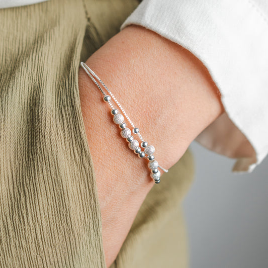 Pulsera doble esferas brillantes