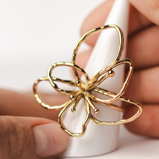 Anillo ajustable flor bañado en oro