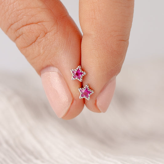 Aros pegados estrella fucsia cierre pelotita