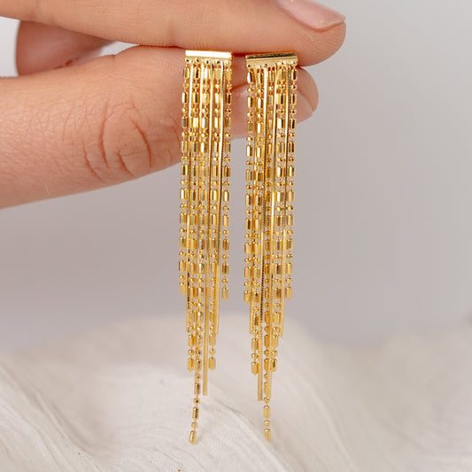 Aros colgantes palitos bañado en oro