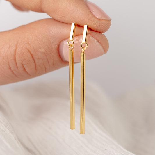 Aros colgante palitos bañado en oro