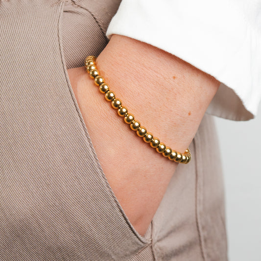 Pulseras esferas bañado en oro