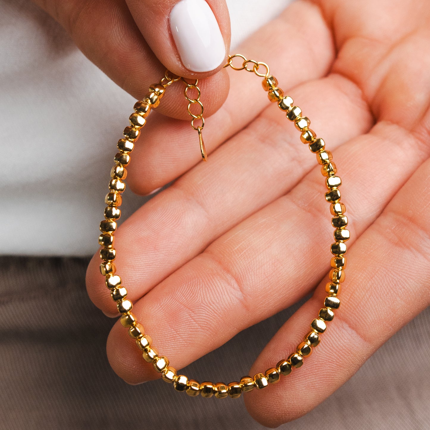 Pulsera mostacillas bañado en oro