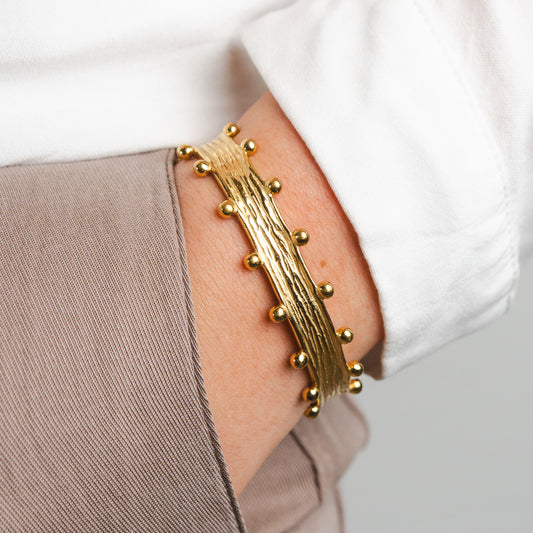 Pulsera esclava esferas bañado en oro