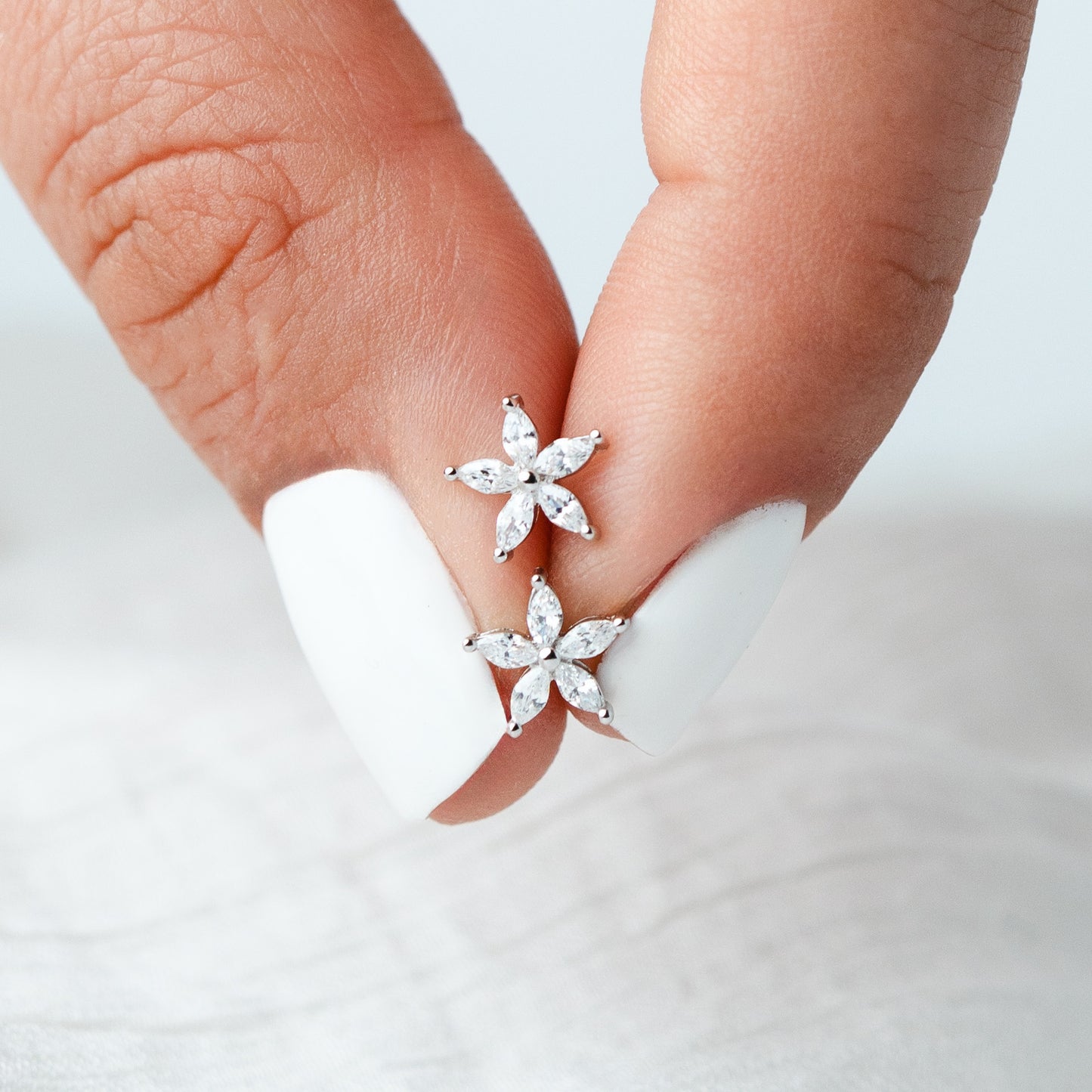 Aros pegados flor cierre pelotita