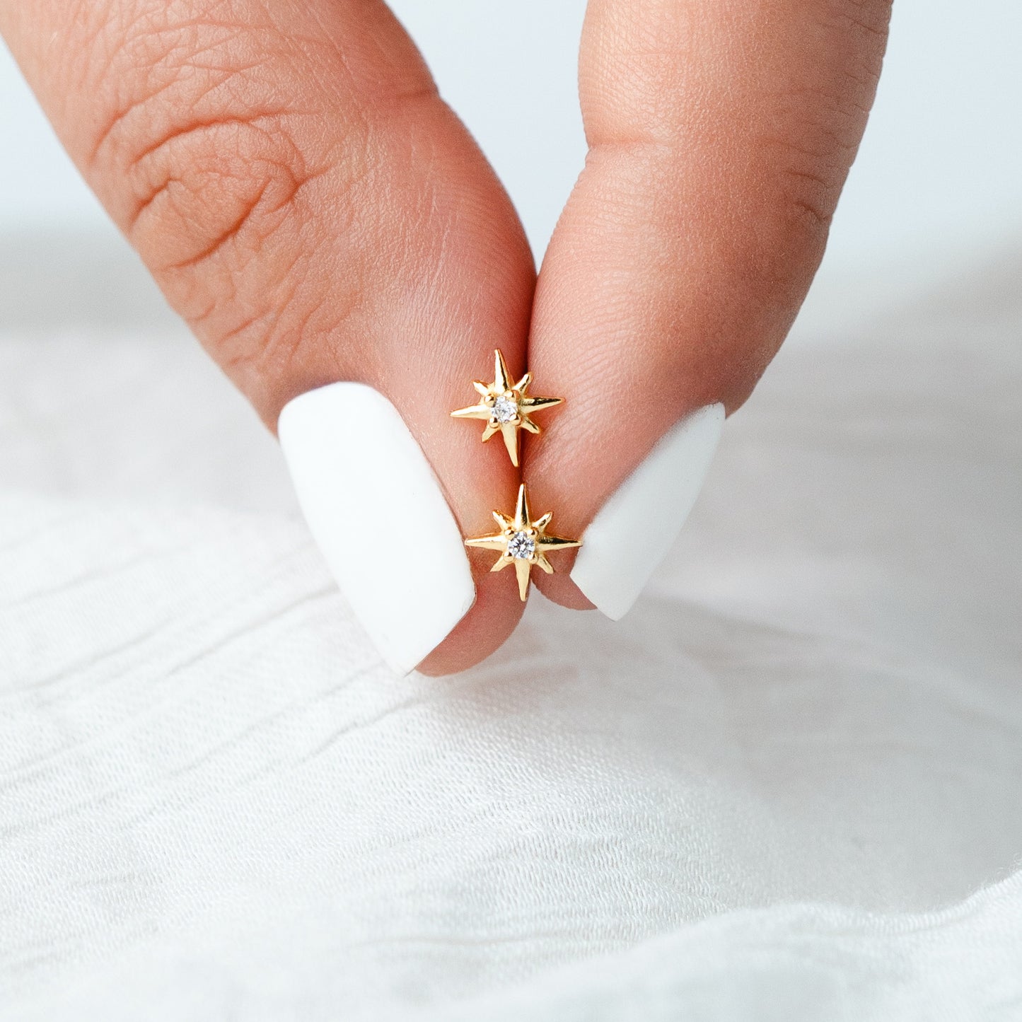 Aros pegados mini star cierre pelotita bañado en oro