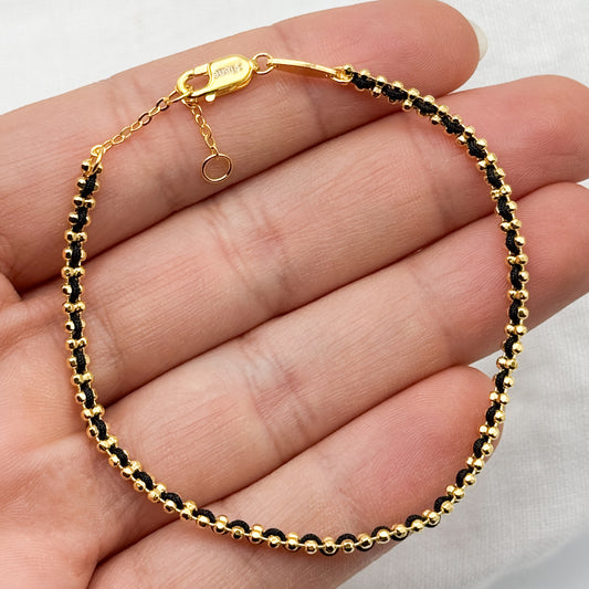 Pulsera diseño cinta negra bañado en oro